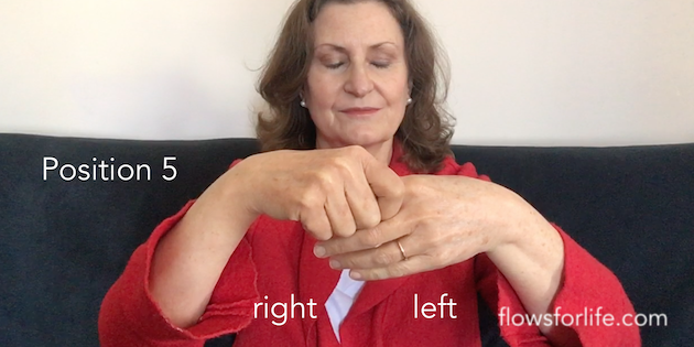 Position 5 holding left index finger
